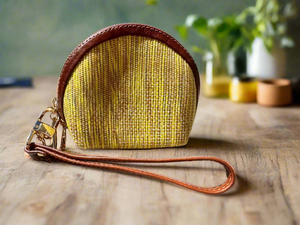 Yellow woven purse with brown strap 